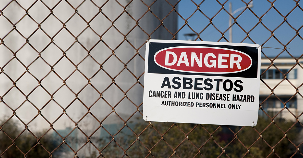 Danger: Asbestos Hazards sign on a work site
