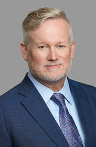 Professional headshot of Firm Founder John Simmons