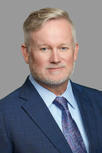 Professional headshot of Firm Founder John Simmons