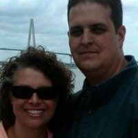 Ginger and her husband smiling together