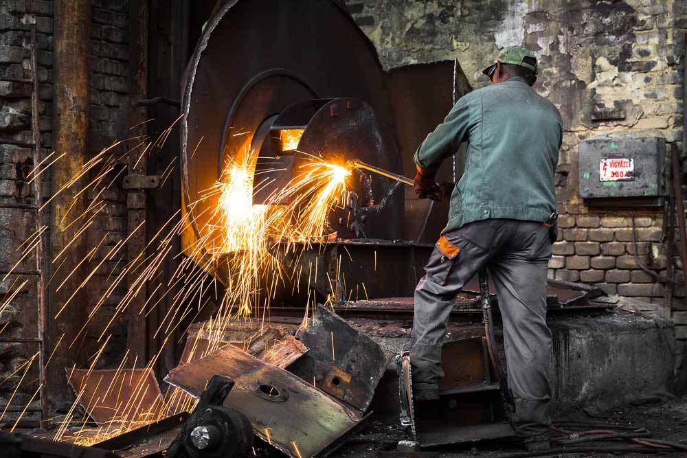 A welder at work with sparks flying