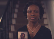 LaTanya, a Simmons Firm client, holds up a photo of her late husband