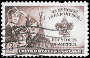 A Stamp printed in USA shows the Three Boys, Statue of Liberty and Scout Badge, circa 1950