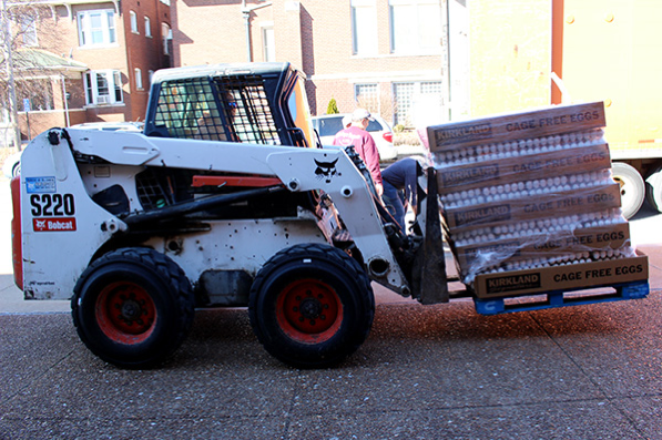 Fresh eggs are delivered for families waiting for food baskets.