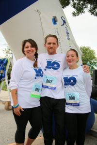 family posing at 5k race