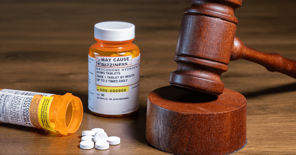 orange prescription bottles and gavel