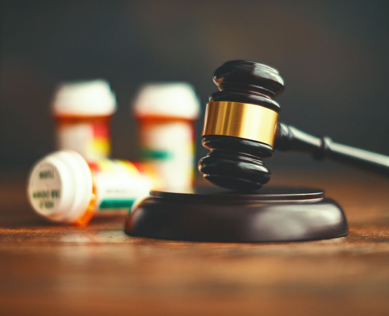 gavel beside pharmaceuticals