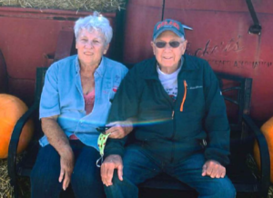 Mesothelioma client Bill Trokey and his wife Cathy sitting outside together