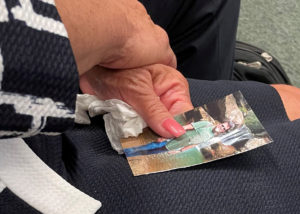 Dan Rugg's wife holding his picture on her lap in court during the trial