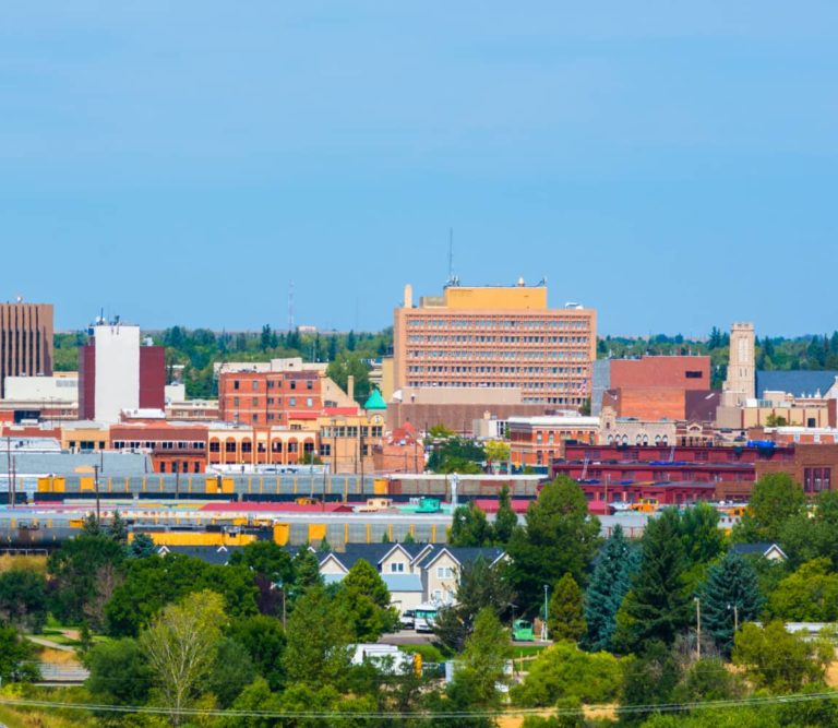 Cheyenne downtown skyline with train cars and houses