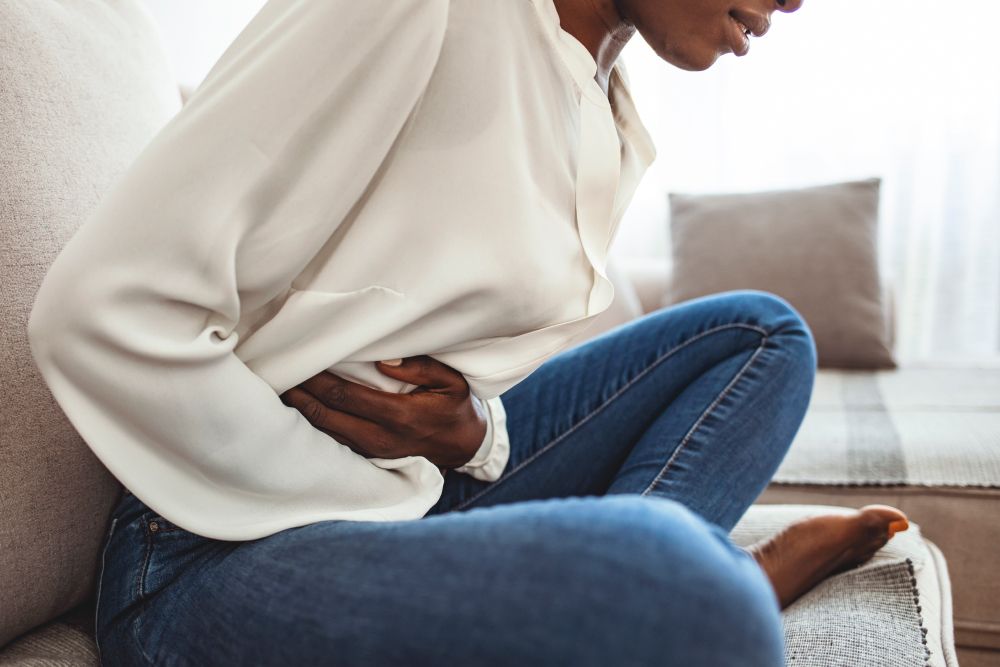 woman struggling with abdominal and pelvic pain