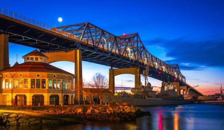 A bridge over the water at night