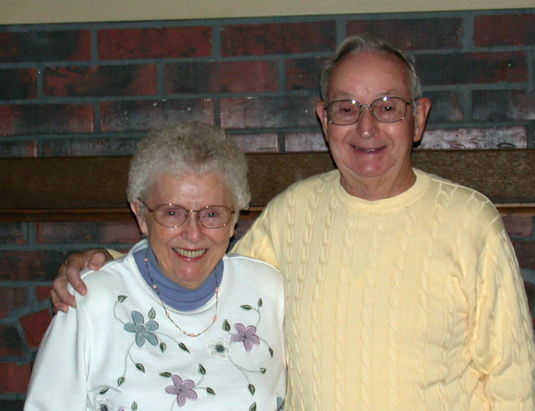 Burlene Jones and her husband stand together and smile