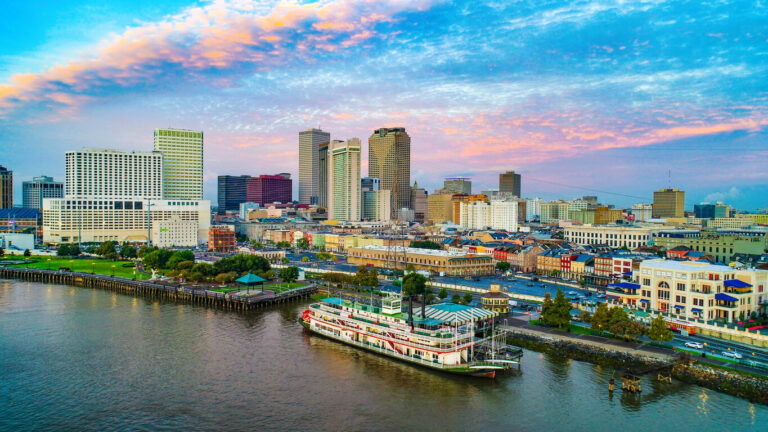 A picture of New Orleans showing the water with the city in the background