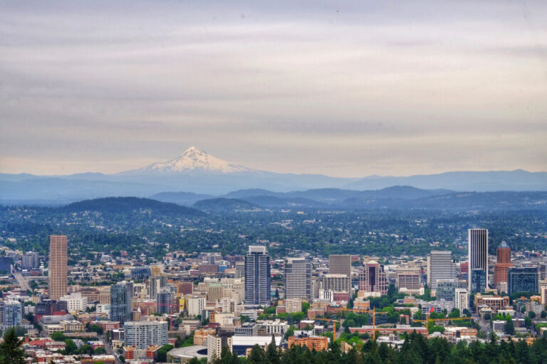 Bird's-eye view of Portland, OR with mountains in the background