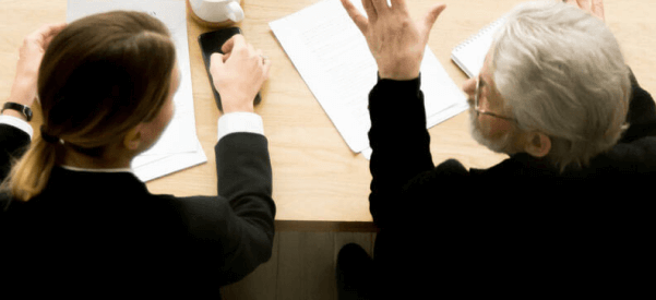 Aerial view of attorneys working at a conference table