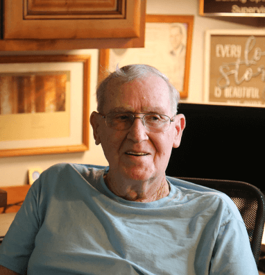 Art Putt, a Simmons Hanly Conroy client, sitting in a chair at home