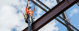 Construction worker on a steel beam
