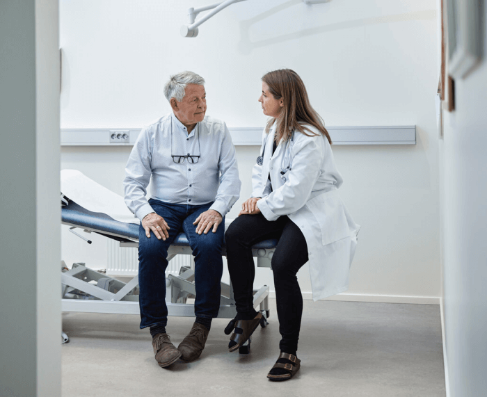 A doctor talks to her patient