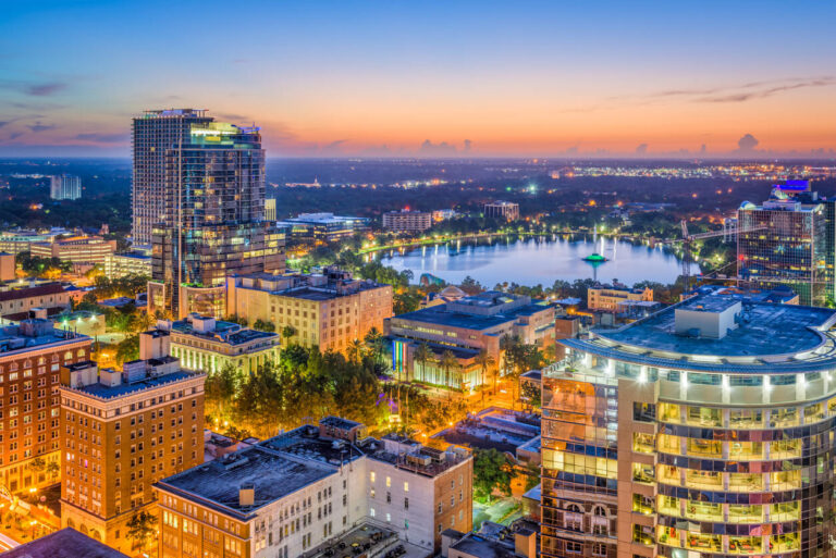 The city of Orlando, Florida lit up at dusk