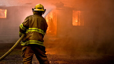 fire fighter extinguish home blaze