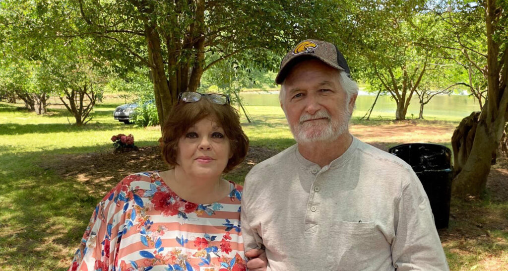 Sid and his wife outside