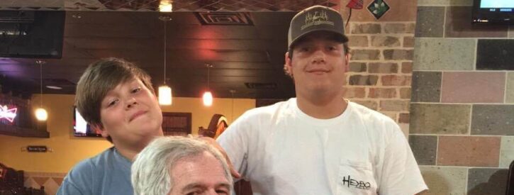 Sid Toney sitting in a restaurant with his boys