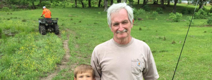 Sid Toney fishing with his grandson