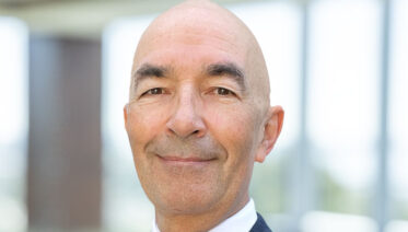 Attorney Juan Bauta in the office with a tie