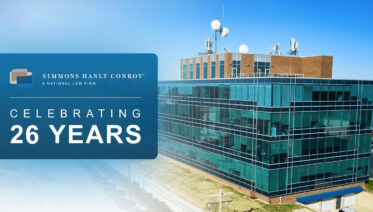 An image of the firm's office with text reading "Simmons Hanly Conroy: Celebrating 26 Years"