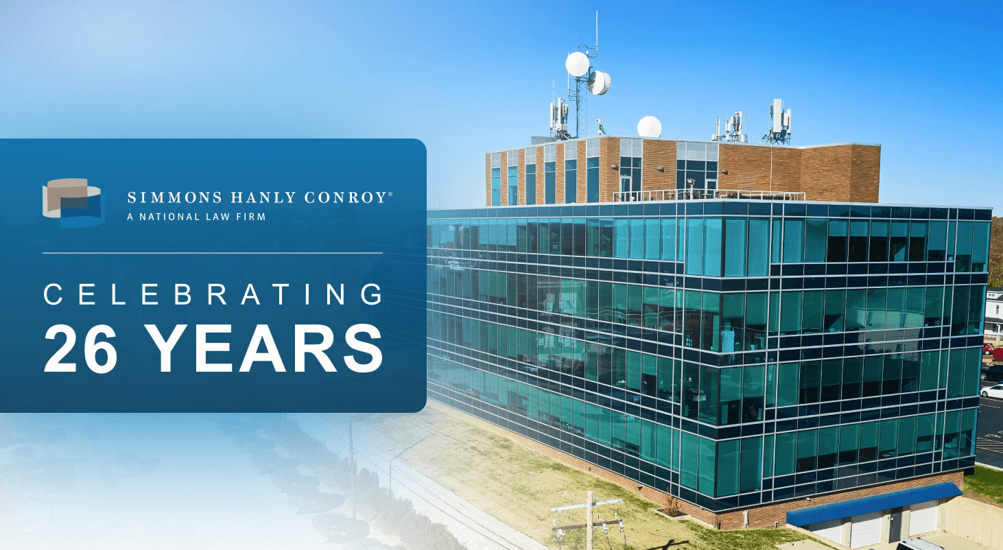 An image of the firm's office with text reading "Simmons Hanly Conroy: Celebrating 26 Years"