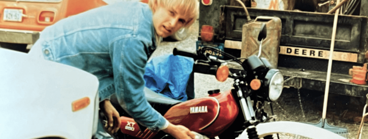 David working on a motorcycle