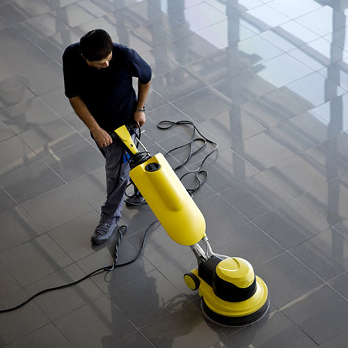 Janitor shining the floors