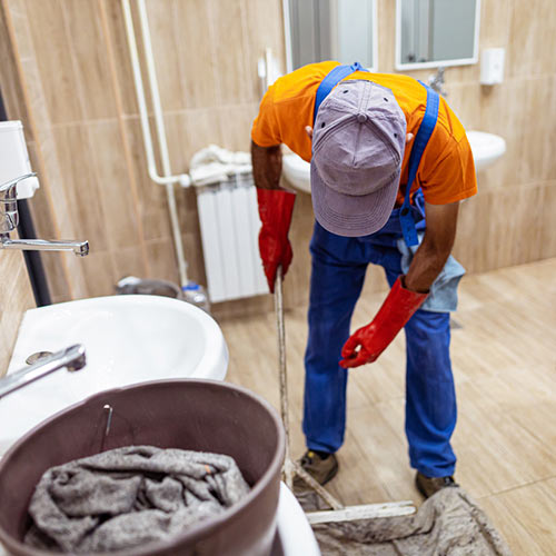Worker around plumbing fixtures
