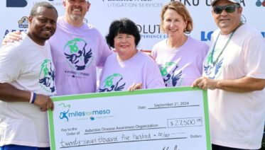 Linda Reinstein at Miles for Meso as she receives a donation check to ADAO